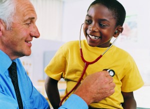 Pediatrician with boy patient. Personalize marketing - business is about relationships between people